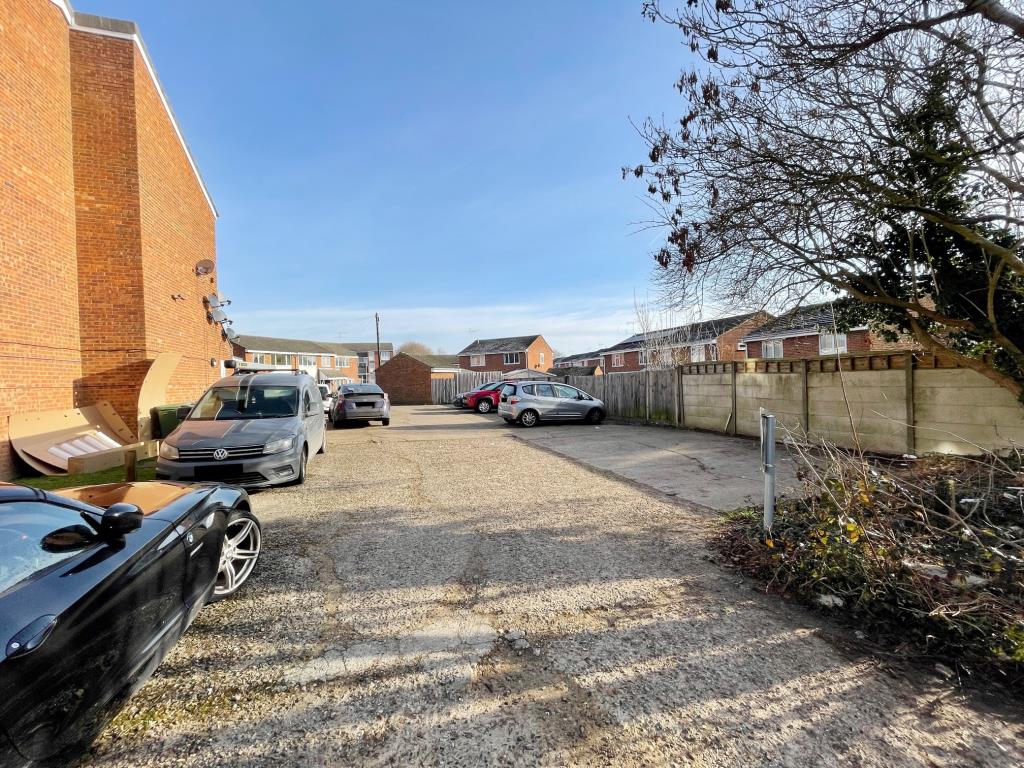 Lot: 96 - TWO PARCELS OF LAND WITH PLANNING FOR GARAGES AND BOLLARD PARKING SPACES - Viewof the space for nine parking spaces at Hardwicke Place